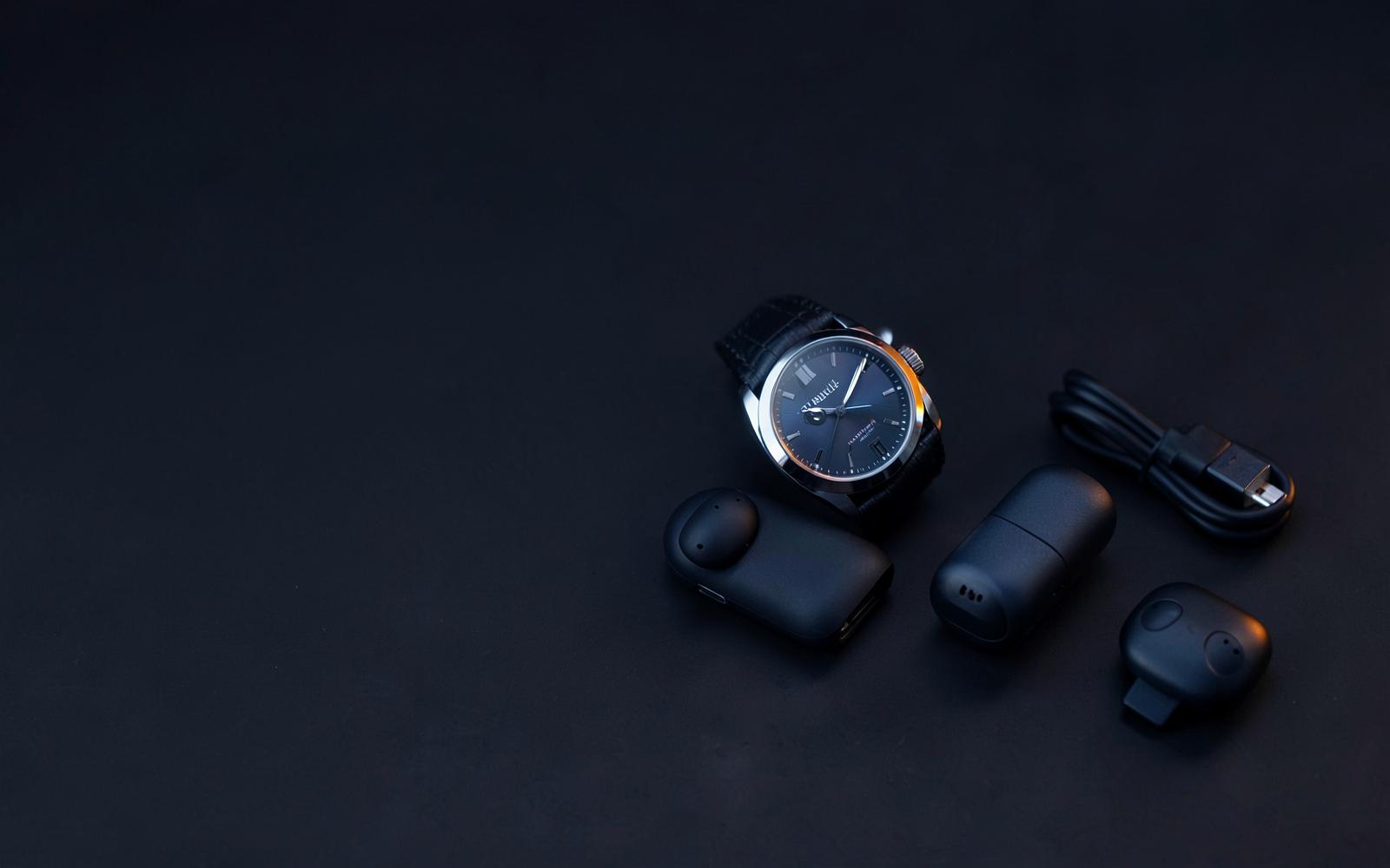 A watch, wireless accessories and useful gadgets displayed together